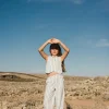 Pantaloni in maglia per bambina a righe in bianco e nero