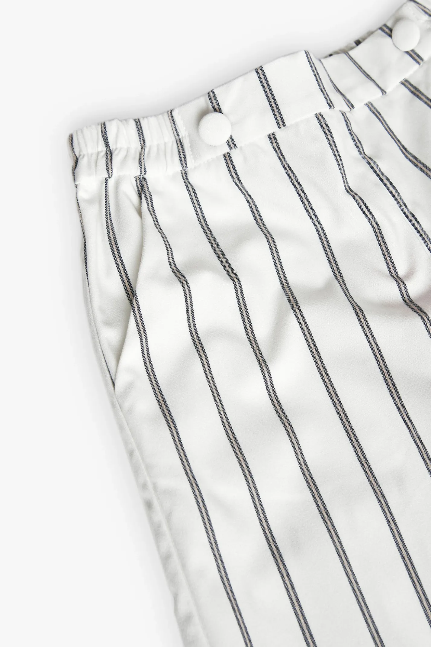 Pantaloni in maglia per bambina a righe in bianco e nero