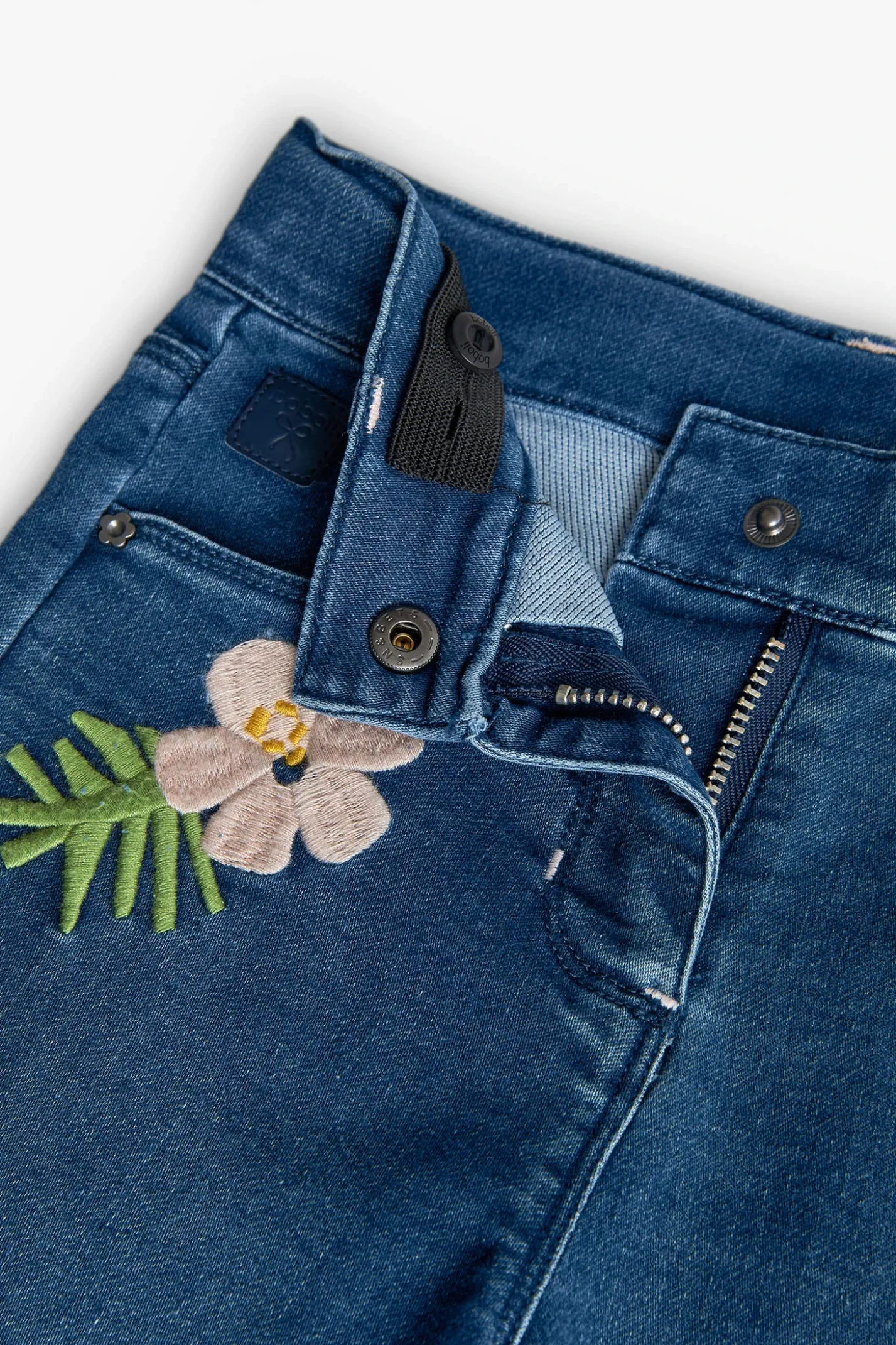 Pantaloni in maglia per neonata in colore blu con ricamo