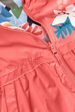 Parka reversibile per bambina in colore rosso.