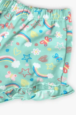 Pigiama in maglia per bambina con stampa di arcobaleni e fiori in tonalità verdi.