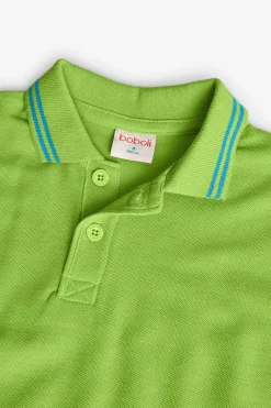 Polo in piqué per bambino di colore verde.