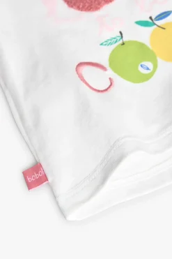Set coordinato con maglietta e pantaloni in maglia per bambina in colore bianco.