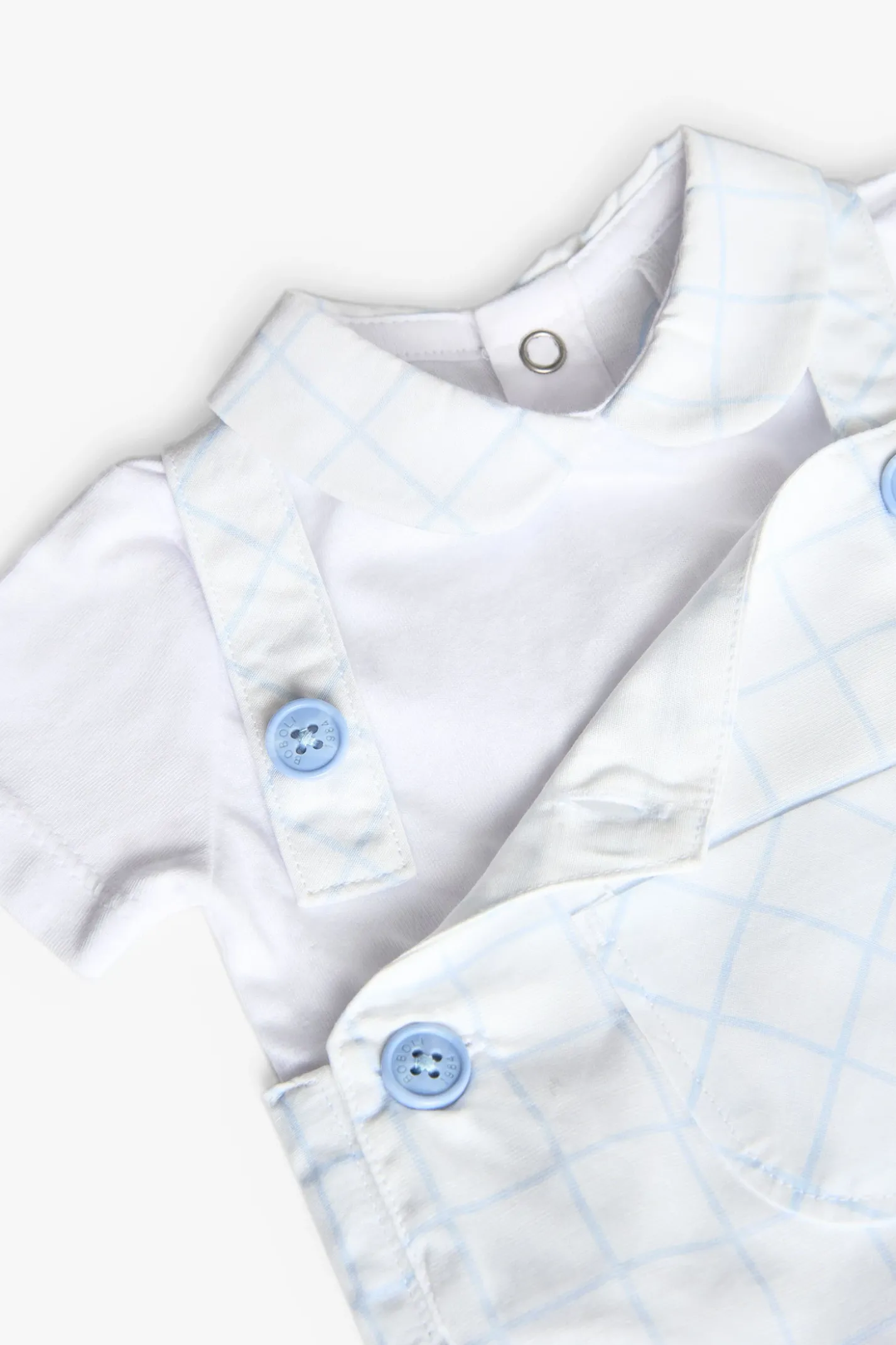 Set da neonato lavorato a maglia in colore bianco con stampa a quadri.