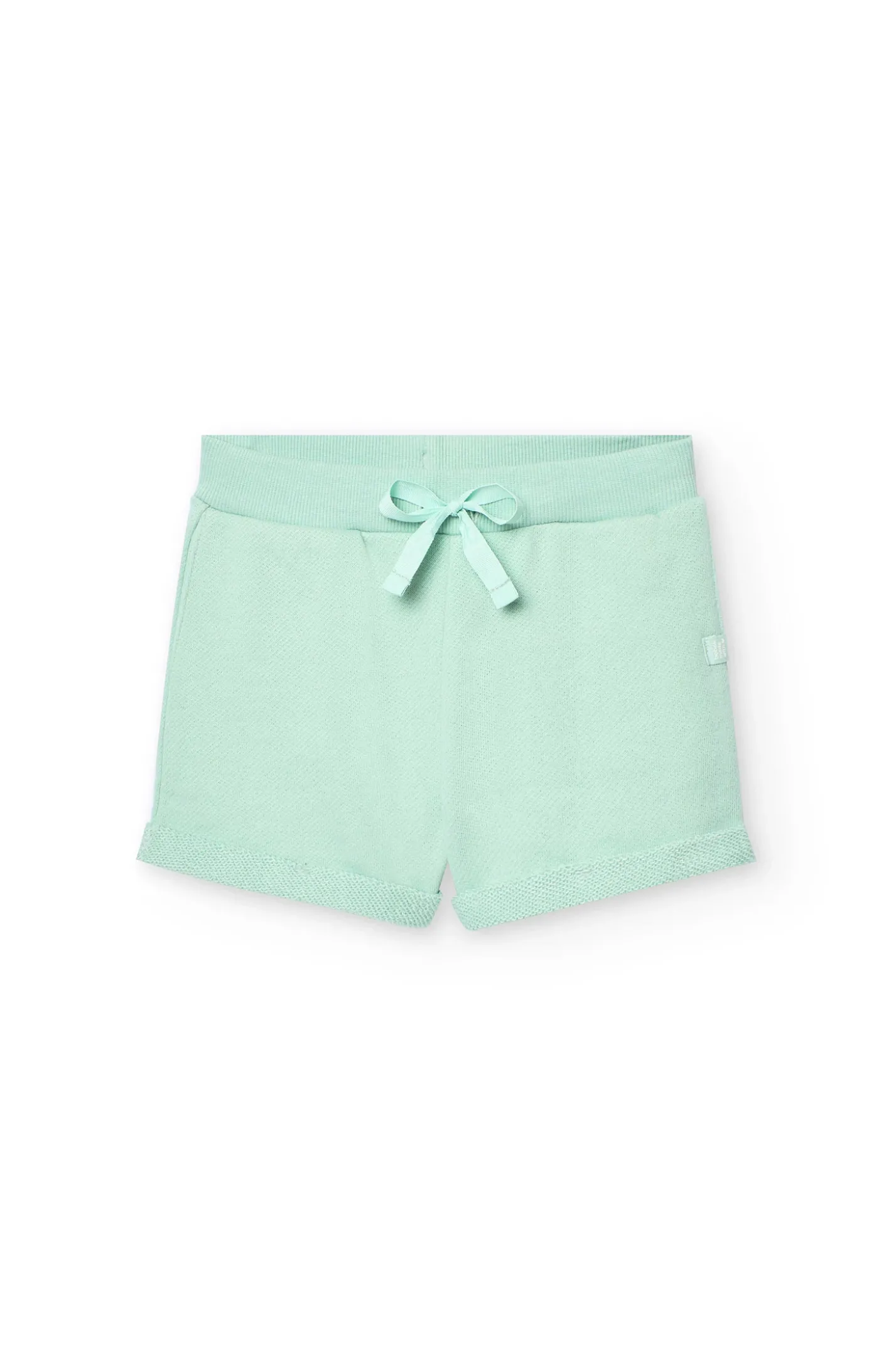 Shorts in felpa per bambina di colore verde.