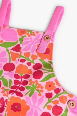 Tuta in maglia per bambina con design floreale in rosa e verde.