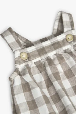 Tutina in maglia per bebé a quadri nei toni della terra.