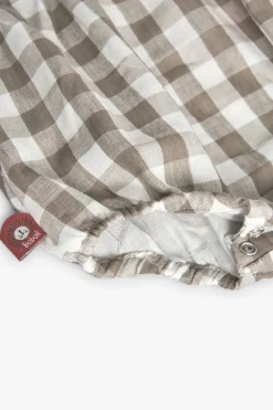 Tutina in maglia per bebé a quadri nei toni della terra.