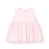 Vestitino in batista per neonata di colore rosa ricamato.
