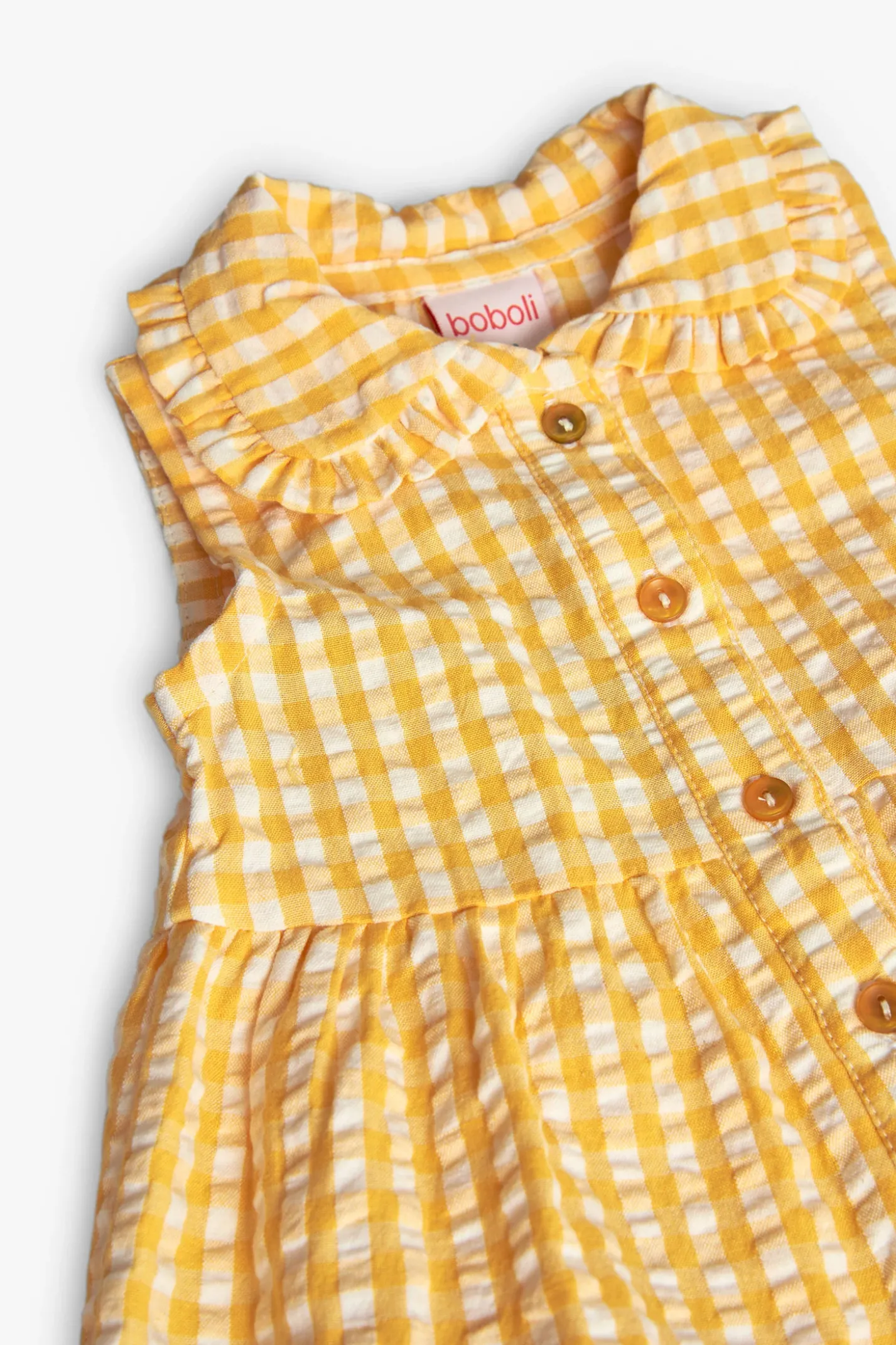 Vestito di popeline per neonata con stampa a quadri di colore giallo.