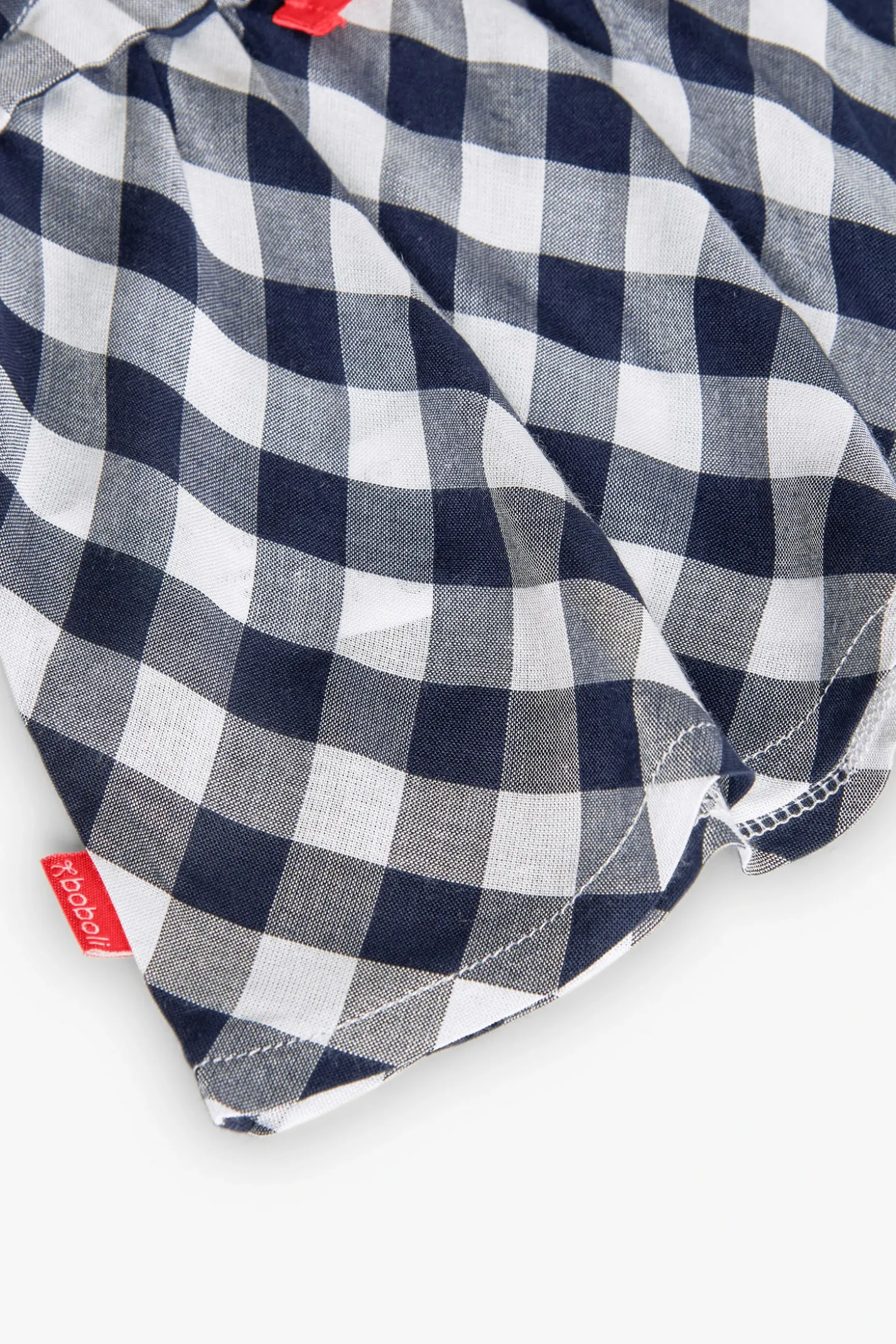 Vestito in viscosa per bambina con motivo a quadretti in colore navy.